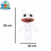 Mimic (2) Mimic plush toy with a wide red toothy grin on a shelf
